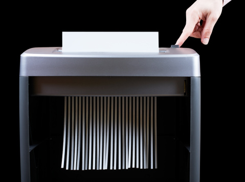 104626001-hand-operating-paper-shredder-gettyimages