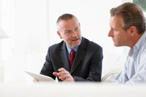 138710659-financial-advisor-talking-to-customer-gettyimages
