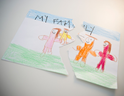 150973506-torn-childs-drawing-depicting-family-gettyimages