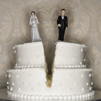 72472453-wedding-cake-visual-metaphor-with-figurine-gettyimages